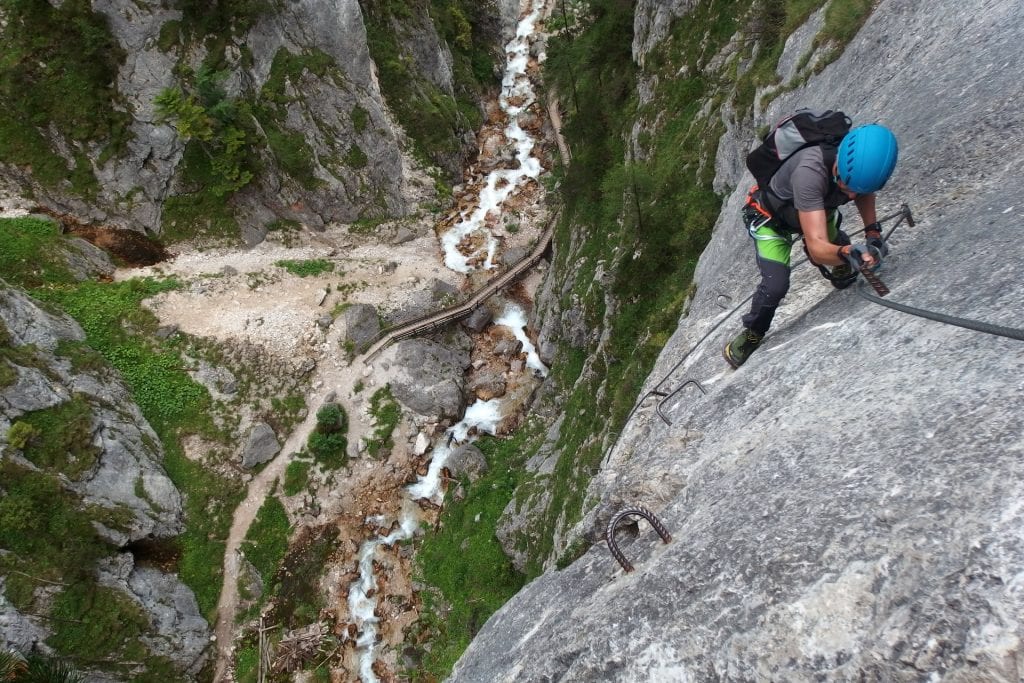 Top view of a person climbing a mountain.