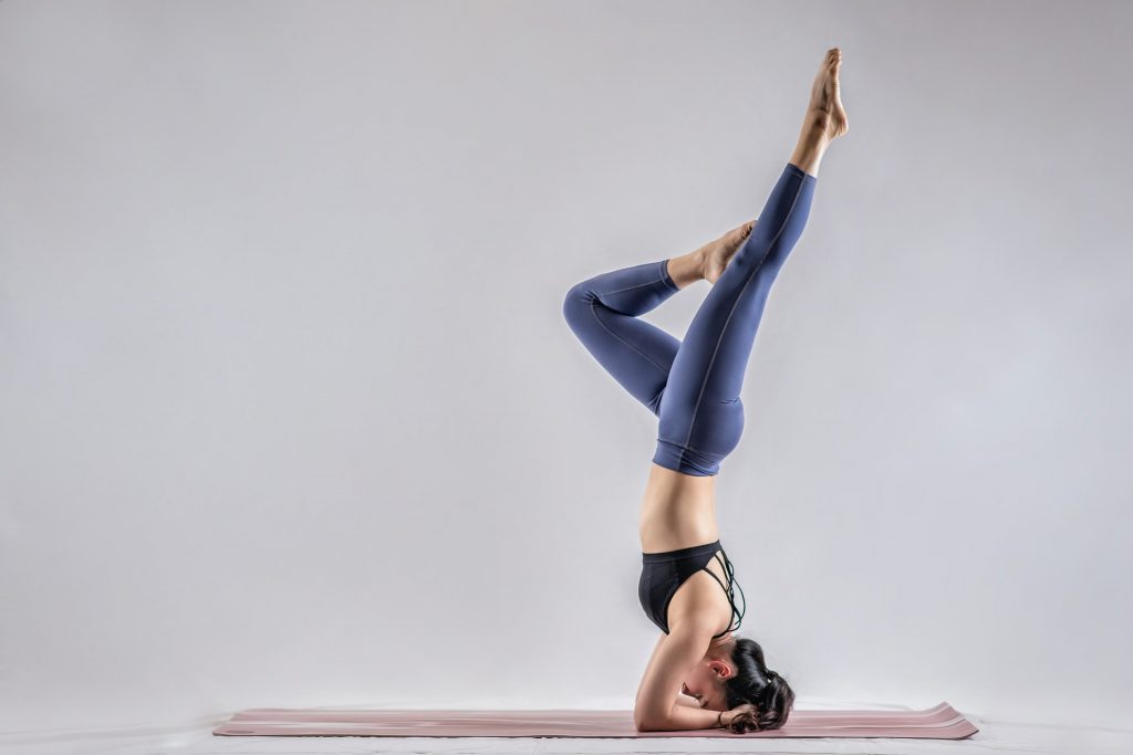 woman doing extreme yoga pose